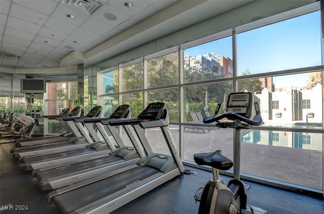 workout area featuring a drop ceiling