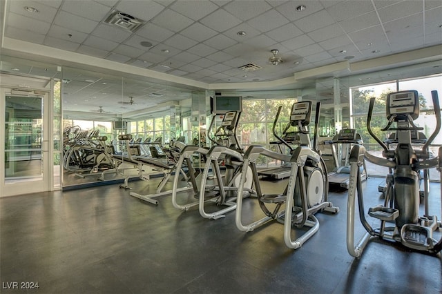 exercise room featuring a drop ceiling