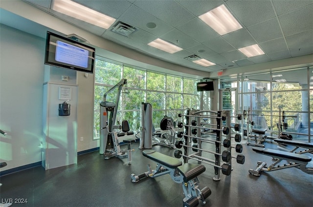 gym featuring a drop ceiling