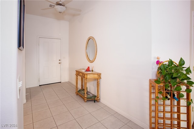 tiled foyer featuring ceiling fan