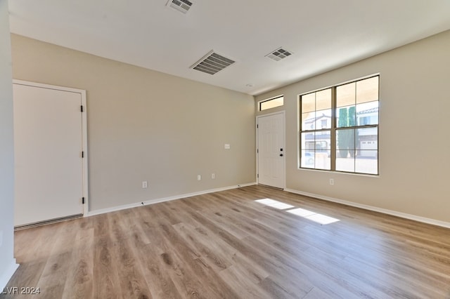 unfurnished room featuring light wood-type flooring