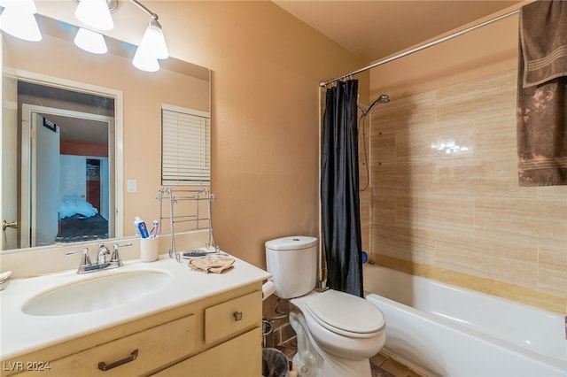 full bathroom with vanity, shower / bath combination with curtain, and toilet