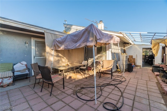 view of patio featuring a pergola