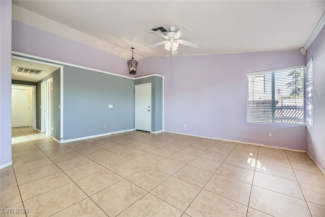 unfurnished room featuring light tile patterned floors, ceiling fan, and lofted ceiling