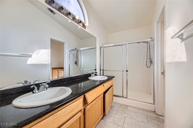 bathroom featuring tile patterned flooring, vanity, an enclosed shower, and lofted ceiling