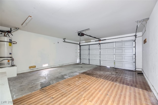 garage with strapped water heater and a garage door opener