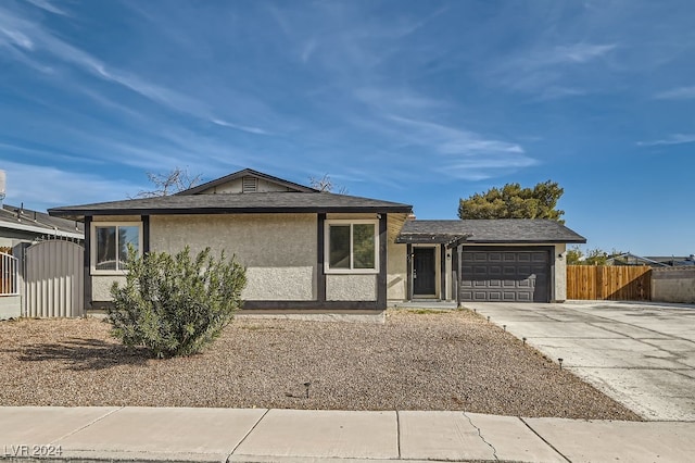 ranch-style home featuring a garage