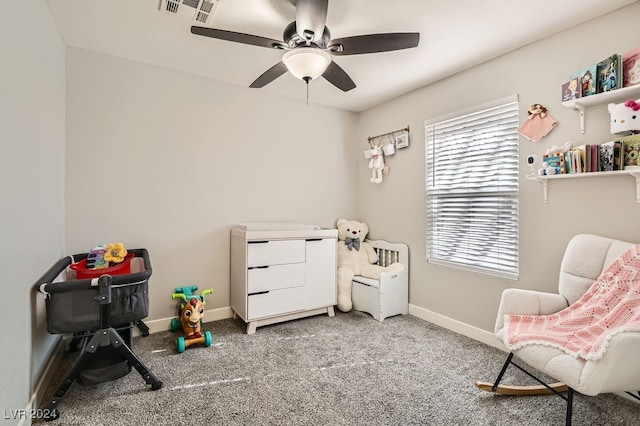 playroom featuring carpet flooring, ceiling fan, and a healthy amount of sunlight