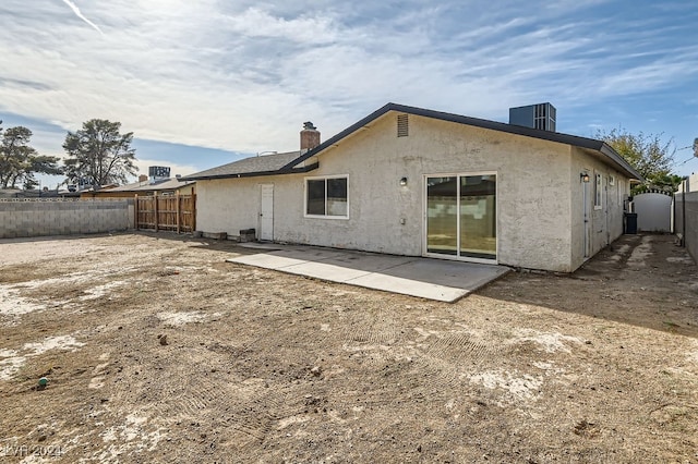 back of house with a patio