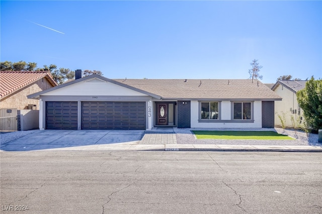 ranch-style home with a garage