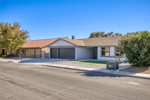 ranch-style house featuring a garage