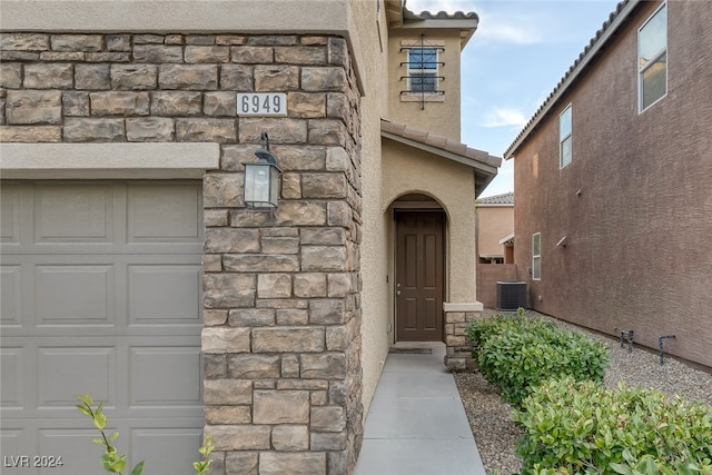 doorway to property with central air condition unit