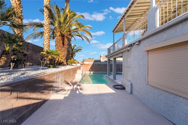 view of swimming pool featuring a patio