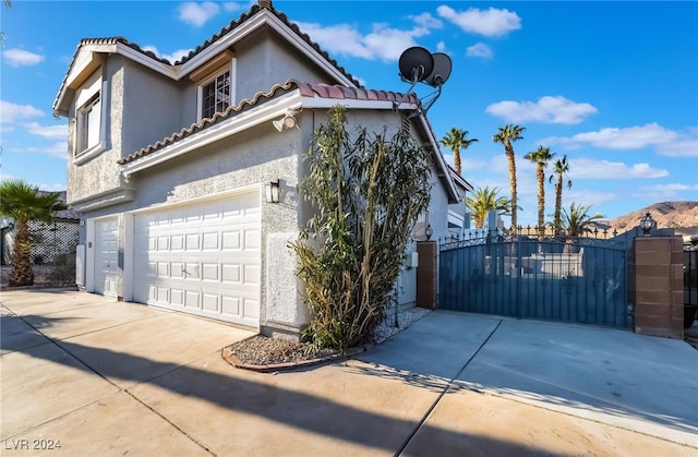 view of property exterior featuring a garage