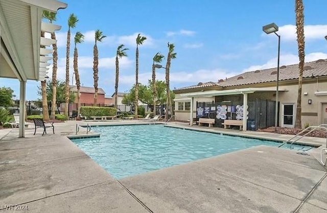 view of swimming pool with a patio