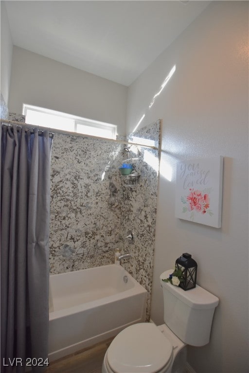 bathroom with shower / bath combo with shower curtain, wood-type flooring, and toilet