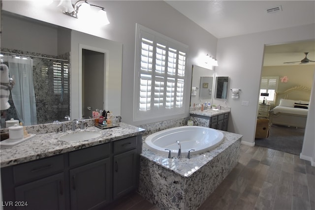 bathroom featuring hardwood / wood-style floors, vanity, shower with separate bathtub, and ceiling fan