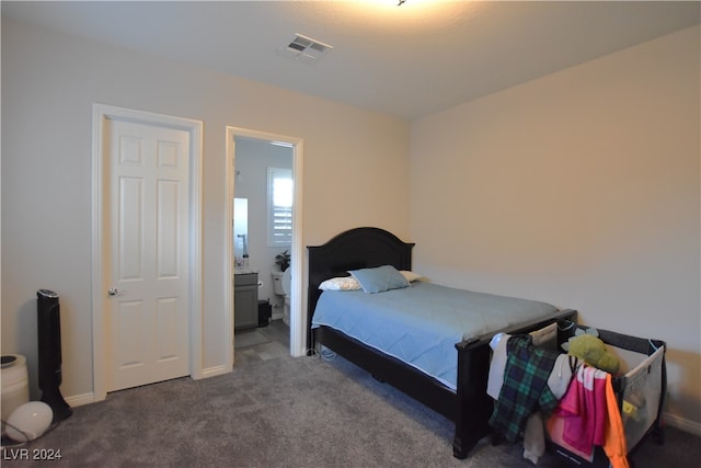 carpeted bedroom with ensuite bathroom