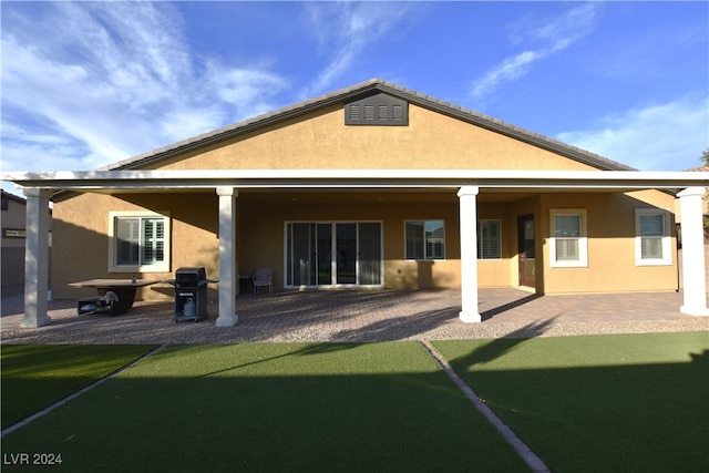 back of house with a patio area