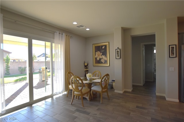 dining room with dark hardwood / wood-style floors