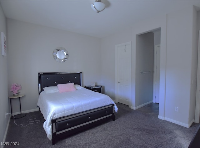 bedroom with dark carpet