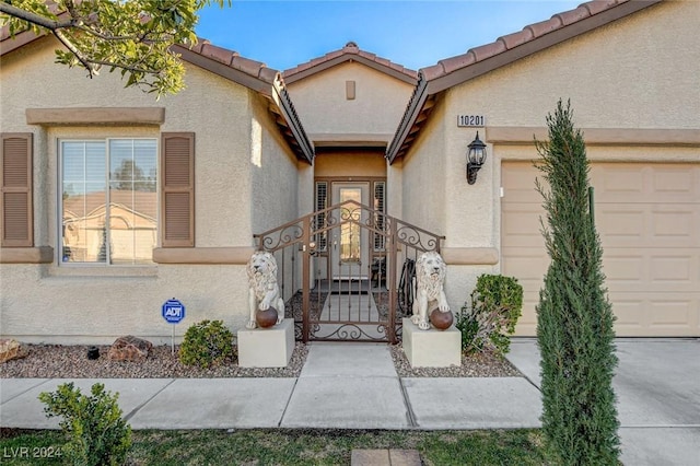 entrance to property featuring a garage