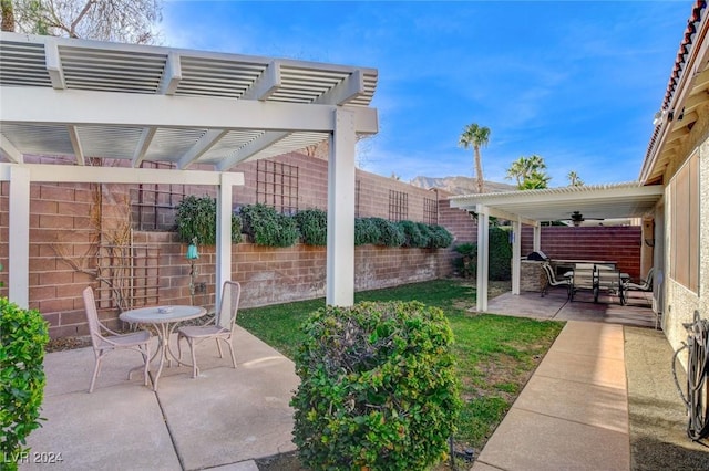 view of patio / terrace featuring a pergola and ceiling fan