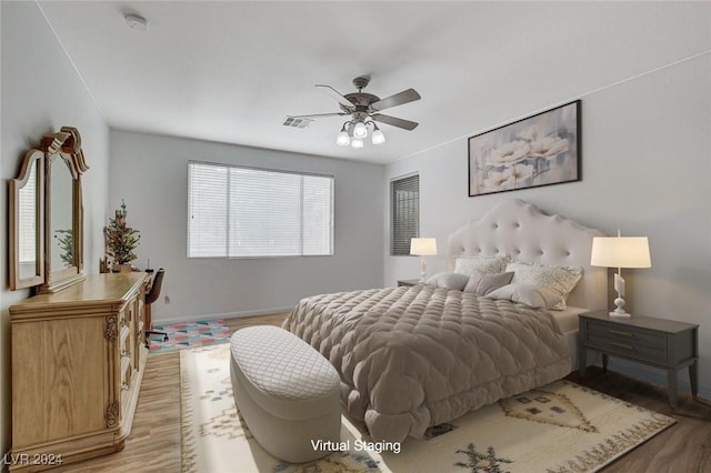 bedroom featuring light wood-type flooring and ceiling fan