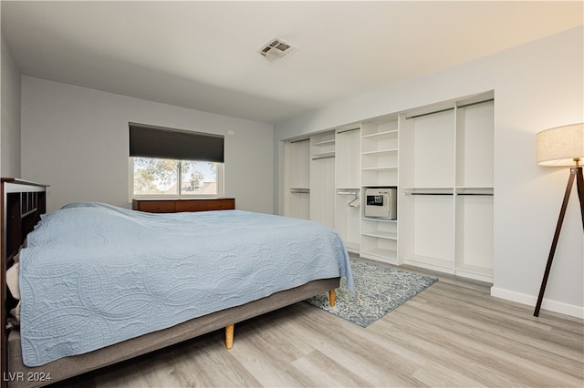 bedroom with light hardwood / wood-style flooring