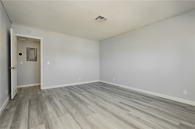 unfurnished room with light hardwood / wood-style floors