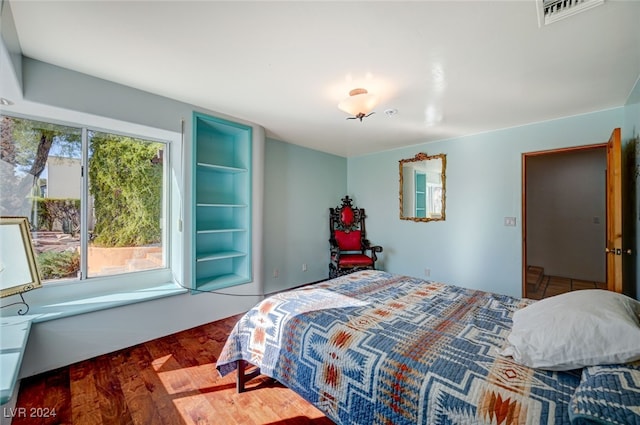 bedroom featuring dark wood-type flooring