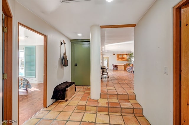 corridor with light hardwood / wood-style flooring