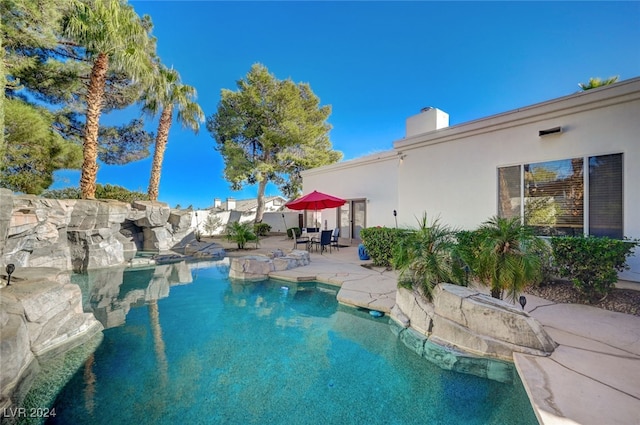 view of swimming pool featuring a patio