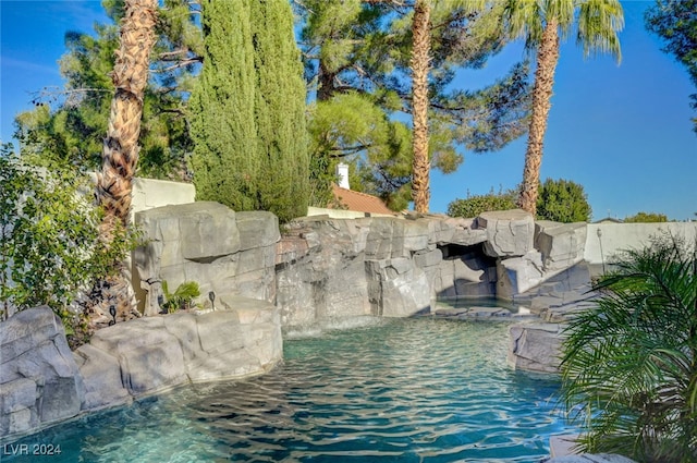 view of pool featuring pool water feature