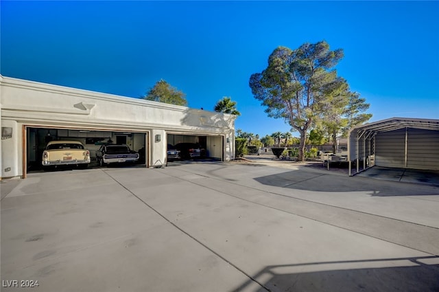 exterior space featuring a garage and a carport