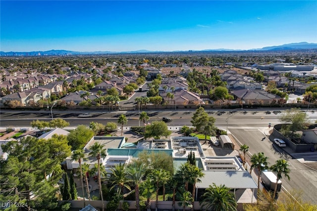 birds eye view of property featuring a mountain view