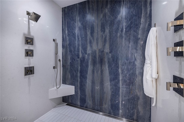 bathroom featuring tiled shower and tile patterned floors