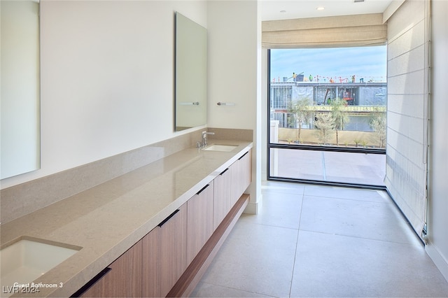 bathroom with tile patterned flooring and vanity