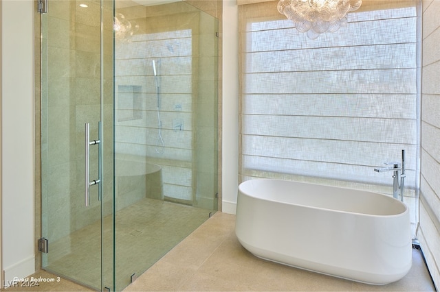 bathroom featuring tile patterned flooring and independent shower and bath