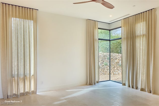 unfurnished room with ceiling fan