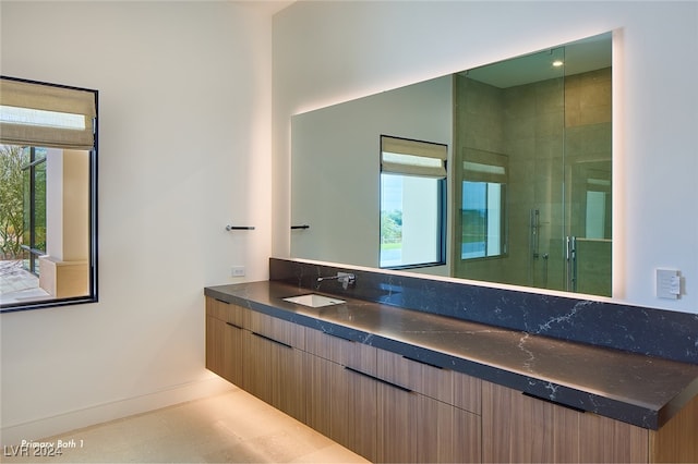 bathroom featuring vanity and walk in shower