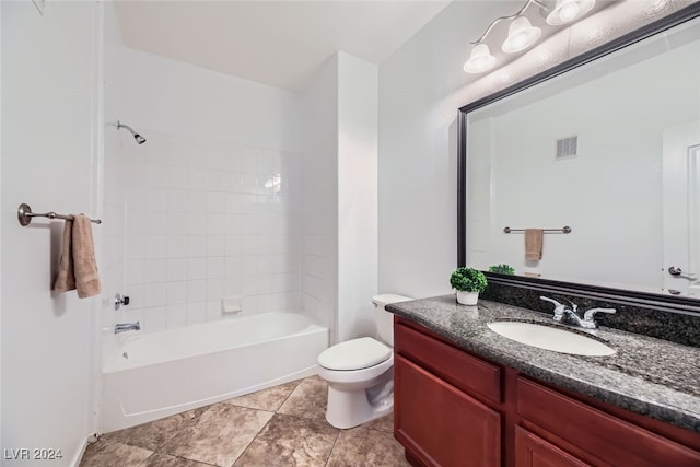 full bathroom featuring vanity, toilet, and tiled shower / bath combo