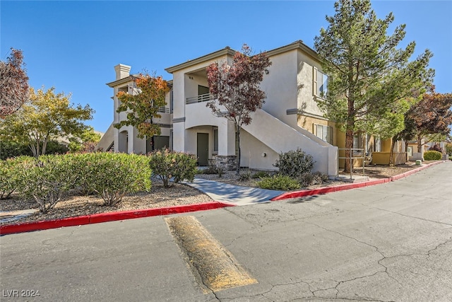 view of front of home with a balcony