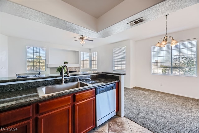 kitchen with ceiling fan with notable chandelier, light colored carpet, sink, dark stone countertops, and dishwasher