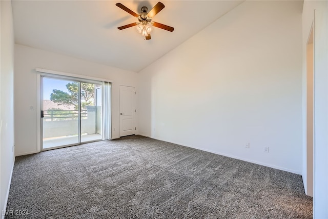 spare room featuring dark colored carpet, high vaulted ceiling, and ceiling fan