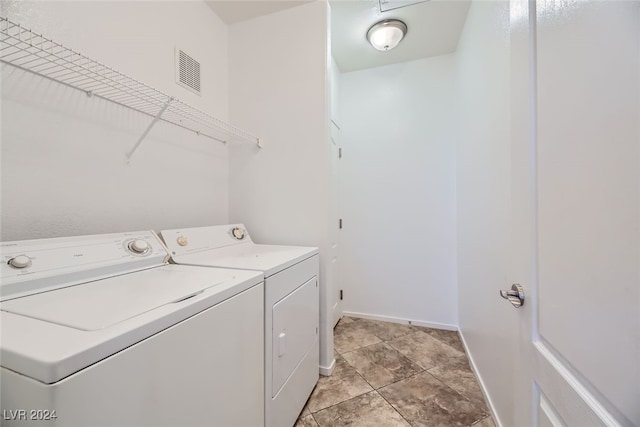 clothes washing area featuring washer and clothes dryer