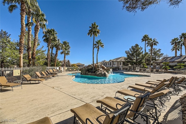 view of pool with pool water feature and a patio area