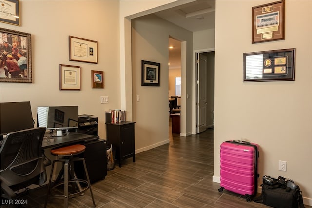 home office with dark hardwood / wood-style floors