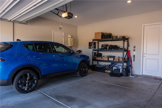 garage featuring a garage door opener and water heater