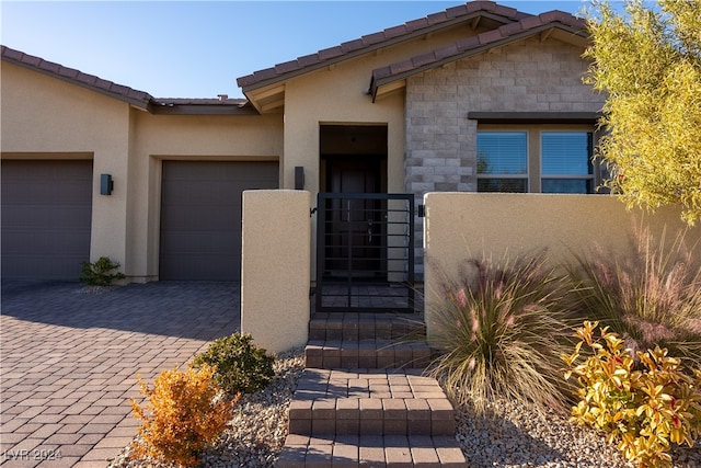 doorway to property featuring a garage